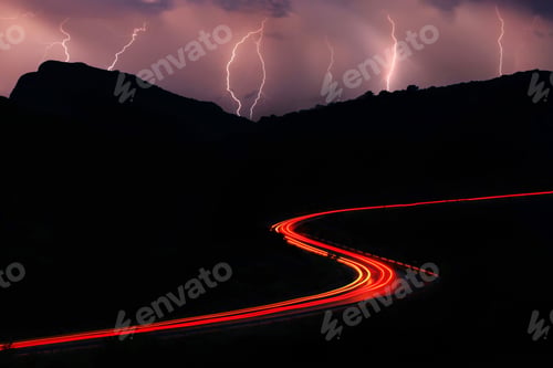 Preview: Night roads in the mountains with a stream of cars