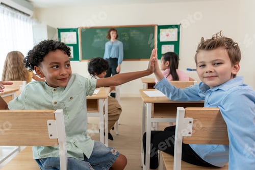 Preview: Portrait of student learn with teacher in classroom at elementary school.