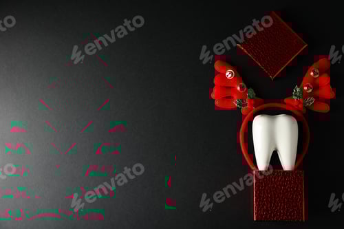 Preview: Teeth with Christmas accessories around, flat lay.