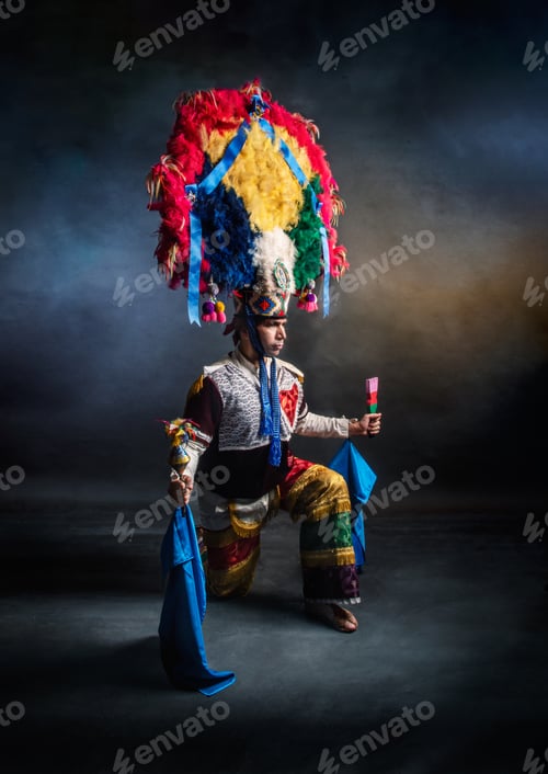 Preview: Oaxaca Feather Dancer, Guelaguetza Mexico A man wearing a colorful costume with a feather headdress