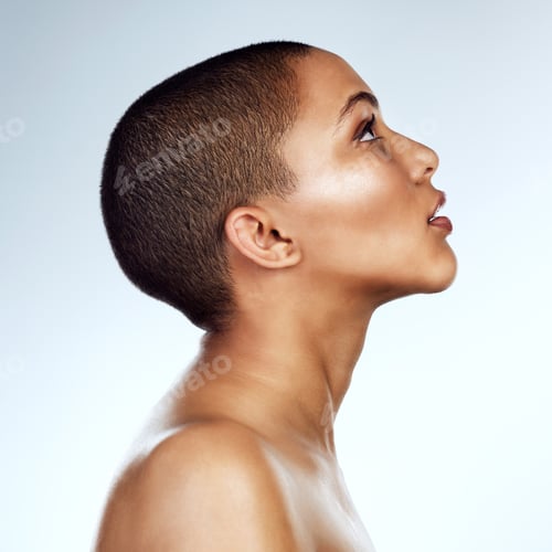 Preview: Stay true to yourself. Profile shot of a beautiful young woman posing against a grey background.