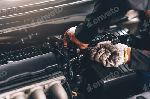 Preview: Close up auto mechanic worker working in garage. Workshop car engine repair service by professional.