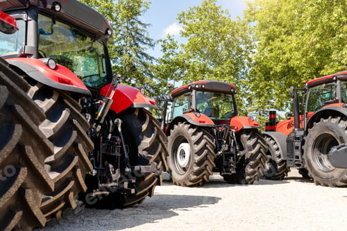 Preview: rear view of red farm tractors. agricultural machinery dealership background.