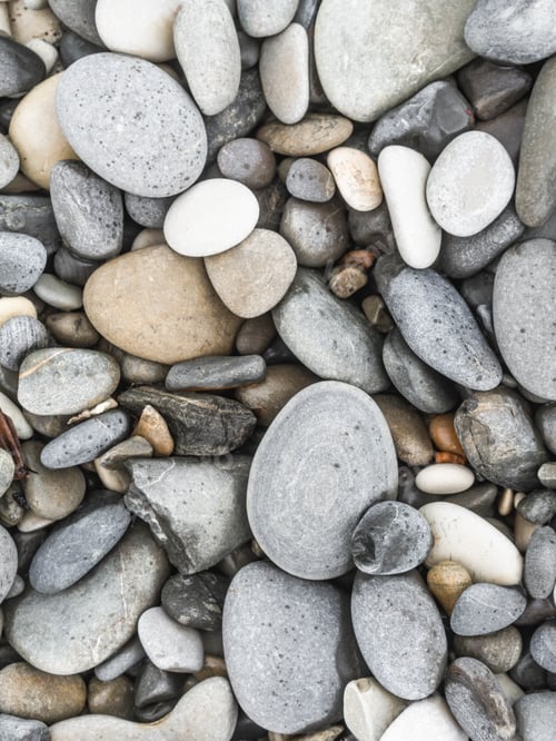 Preview: Pebbles of various colors on the sea coast outdoor