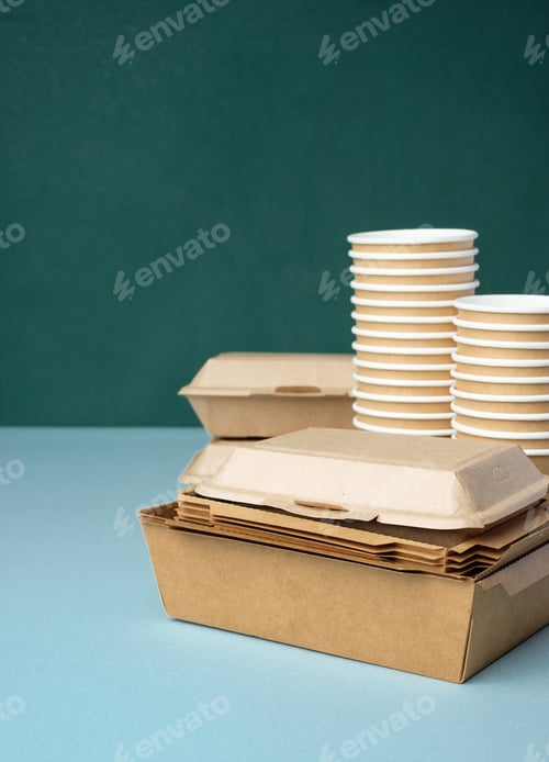 Preview: Eco friendly food ware,disposable cup ,food container, bamboo spoon fork on green table.sustainable