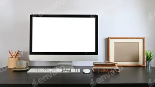 Preview: Orderly workplace with computer and accessories putting together on it.