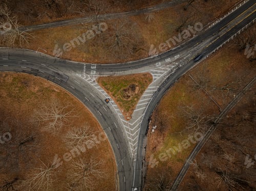 Preview: Top down view over an intersection, in a triangular shape, on a cloudy day in autumn.