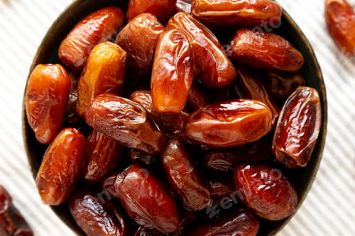 Preview: Organic Raw Dry Dates in a Bowl, top view. Close-up.