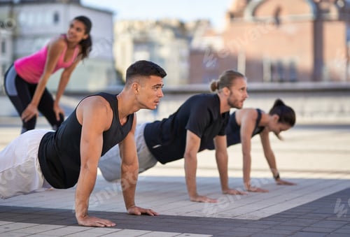 Preview: Two men and two women training outdoors