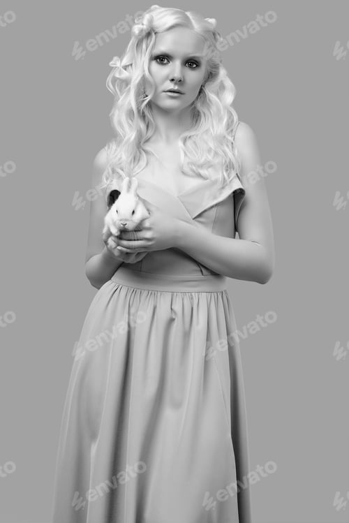 Preview: Fashion Portrait Of Albino Blond Girl With White Skin And Blue Eyes In Elegant Dress Posing With