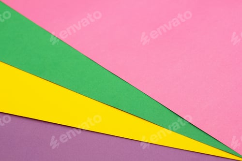 Preview: Multi colored paper background of pink, green, yellow and purple.