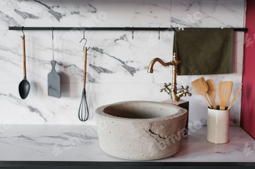 Preview: Stone washbasin with vintage mixer on marble kitchen background