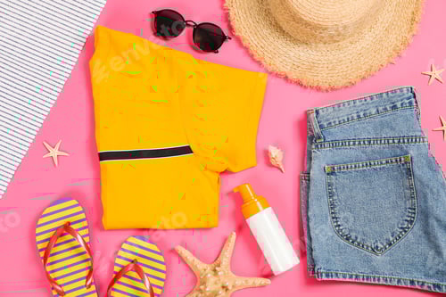 Preview: Sea vacation accessories on yellow background, top view