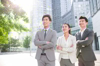 Preview: Young business person looking at view