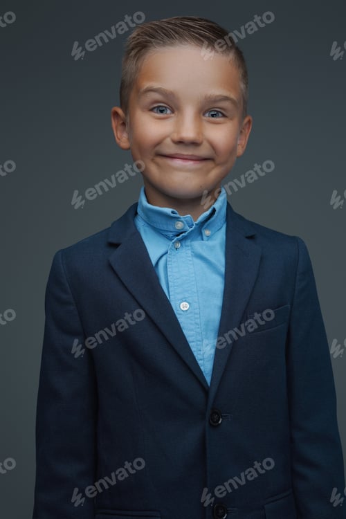 Preview: Joyful preschool boy weared in costume against gray background