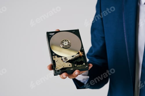 Preview: man holding a hard drive information protection technology