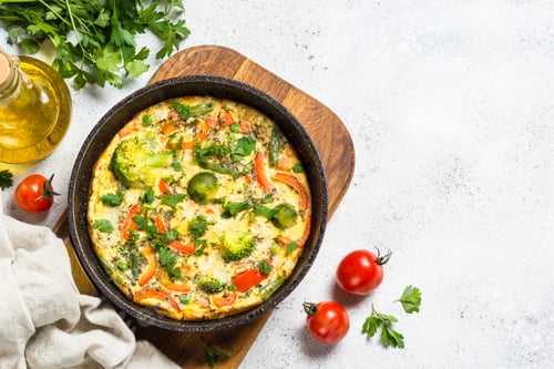 Preview: Frittata with vegetables on white stone table
