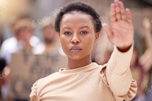 Preview: Youll get nothing more from me. Shot of a young woman holding her hand up to stop at a protest.