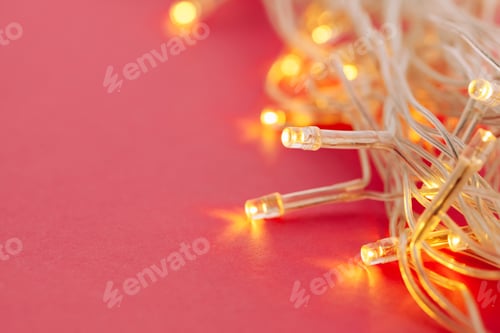 Preview: Illuminated garland lights on bright pink background