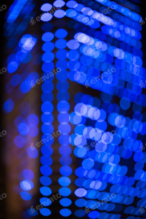 Preview: defocused city building with bokeh lights as background