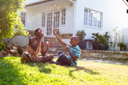 Preview: African American woman and her son, spending time together in the garden