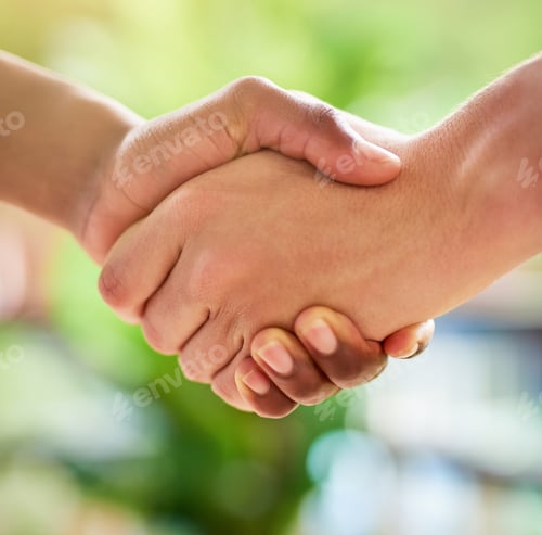 Preview: Pleased to meet you. Cropped shot of two unidentifiable people shaking hands outside.