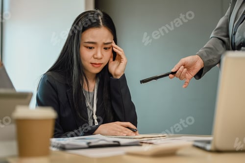 Preview: Upset asian female employee being scolded by supervisor complaining about work.