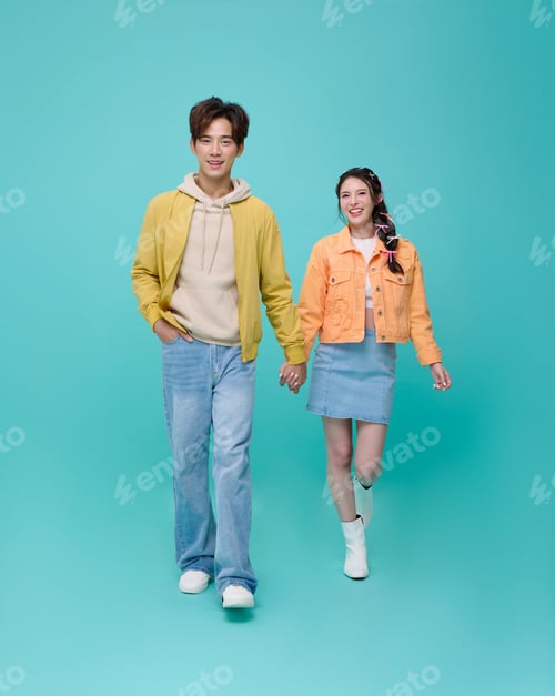 Preview: Portrait happy young Asian couple love holding hand walking looking at camera