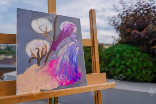 Preview: A close-up of painting standing on an easel in a studio for painting the concept of love of fine art