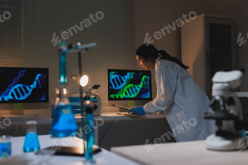 Preview: Scientist working on dna gene research in dark laboratory