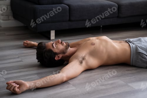 Preview: Shirtless exhausted fitness instructor sleeping after excercise.