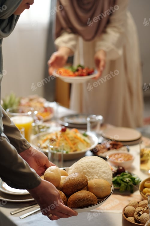 Preview: Unrecognizable Muslim Women Setting Table On Uraza Bayram