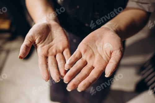 Preview: Hands together make ceramics pregnant girl with a man.