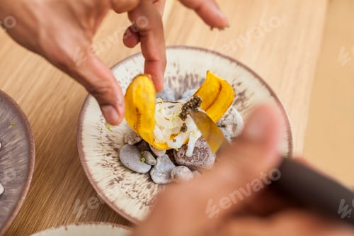 Preview: Closeup of man hands cooking seafood