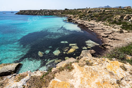 Preview: Aerial shot of Cala Azzura one of the most popular beaches of Favignana Aegaian Islands, Sicily
