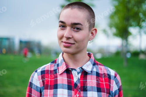 Preview: Portrait bald young woman wearing checkered shirt lifestyle outdoors