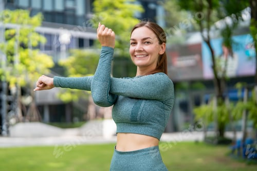 Preview: Portrait of Caucasian sportswoman warm up and exercise in the garden.