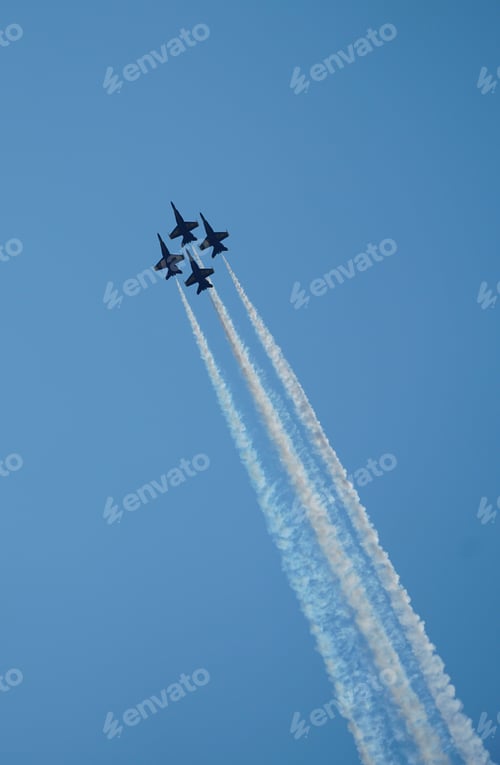 Preview: Aerial view of military planes leaving white smoke