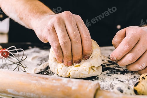 Preview: Hands kneading a dough