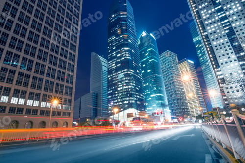 Preview: light trails on the street with modern building