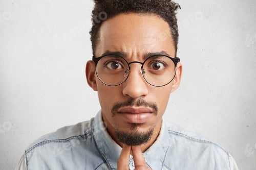 Preview: Close up portrait of handsome fashionable young mixed race male with oval face, dark eyes, mustache