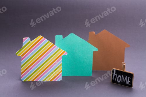 Preview: Paper houses in different colors and home concept.