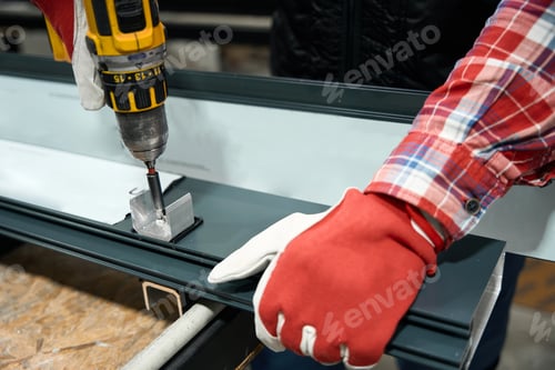 Preview: Male working with tool on steel structure