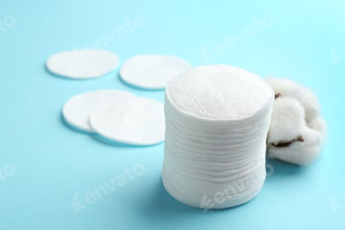 Preview: Cotton pads on color background. Space for text