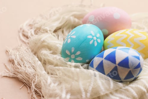 Preview: Colorful pastel easter eggs on fabric with copy space, vintage filter tone