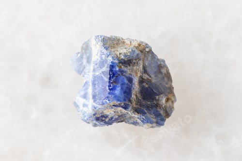 Preview: sample of raw benitoite rock on white marble