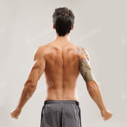 Preview: Rearview of a shirtless man stretching his back before a workout