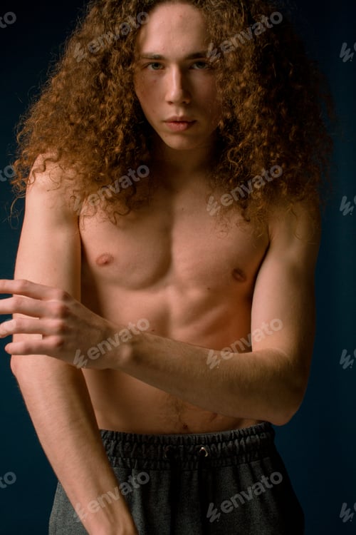 Preview: Attractive And Stylish Guy With Curly Hair And A Sports Figure