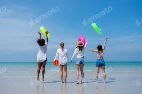 Preview: Happy children laughing and enjoying at beach. Teenage playing with friends at the sea.