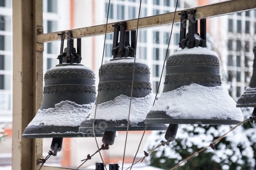 Preview: Church bells covered in snow outside on a cold winter day